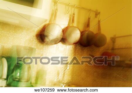 Pots and pans hanging in a domestic kitchen, France View Large Photo Image Stock Photo - Pots and pans hanging in a domestic kitchen, France. Fotosearch