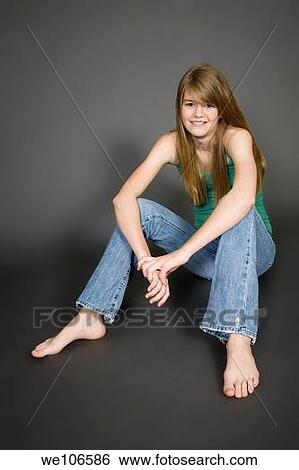 Preteen girl posing on gray background with some attitude View Large Photo Image Stock Photograph - Preteen girl posing on gray background with some attitude. Fotosearch