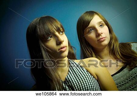 Preteen twin sisters posing View Large Photo Image Picture - Preteen twin sisters posing. Fotosearch