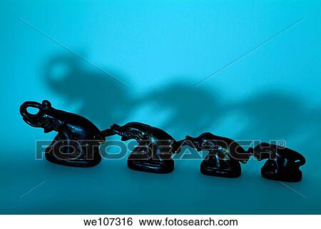Row of elephant ornaments attached by their trunks View Large Photo Image Stock Photograph - Row of elephant ornaments attached by their trunks. Fotosearch