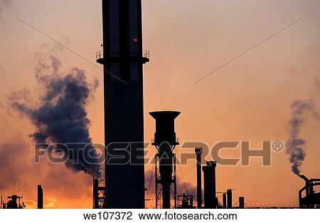 Smoking chimneys of a petroleum refinery at sunset, Berre, France View Large Photo Image Stock Image - Smoking chimneys of a petroleum refinery at sunset, Berre, France. Fotosearch