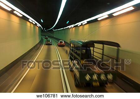Speeding cars inside a tunnel, Hong Kong, China View Large Photo Image Stock Image - Speeding cars inside a tunnel, Hong Kong, China. Fotosearch