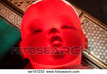 Spooky looking doll´s head glowing red View Large Photo Image Stock Image - Spooky looking doll´s head glowing red. Fotosearch