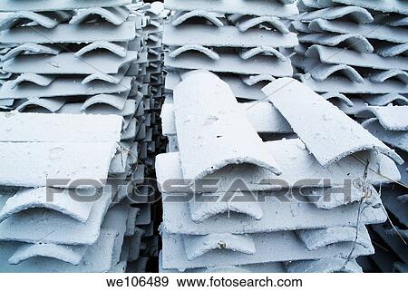 Stacks of white roofing tiles View Large Photo Image Stock Photo - Stacks of white roofing tiles. Fotosearch
