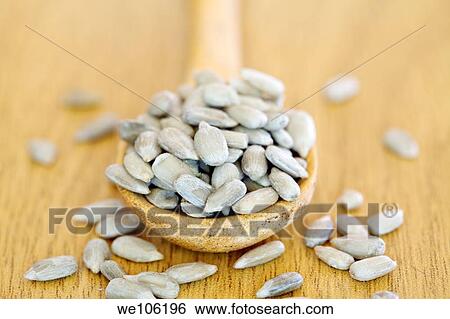 Sunflower seeds in Wooden Spoon View Large Photo Image Stock Photograph - Sunflower seeds in Wooden Spoon. Fotosearch