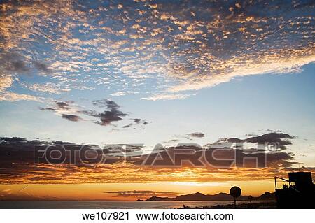 Sunset along Barra da Tijuca Beach in Rio de Janeiro in Brazil View Large Photo Image Stock Image - Sunset along Barra da Tijuca Beach in Rio de Janeiro in Brazil. Fotosearch