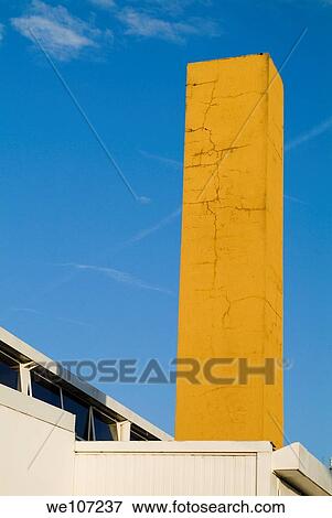 Tall brick chimney painted yellow View Large Photo Image Stock Photo - Tall brick chimney painted yellow. Fotosearch