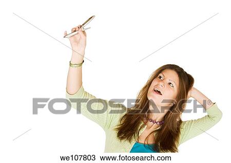 Stock Image - Teen talking on the cell phone. Fotosearch