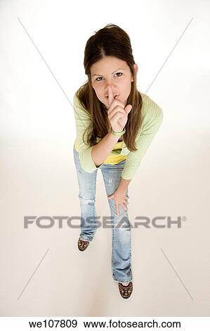 Teenage girl posing on a white background View Large Photo Image Stock Photo - Teenage girl posing on a white background. Fotosearch