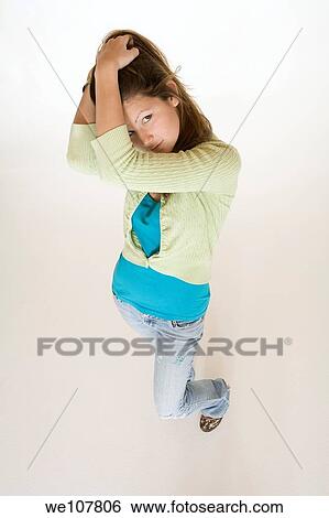 Teenage girl posing on a white background View Large Photo Image Stock Photograph - Teenage girl posing on a white background. Fotosearch