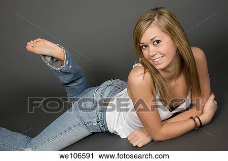 Teenage girl posing on gray background with some attitude View Large Photo Image Stock Image - Teenage girl posing on gray background with some attitude. Fotosearch