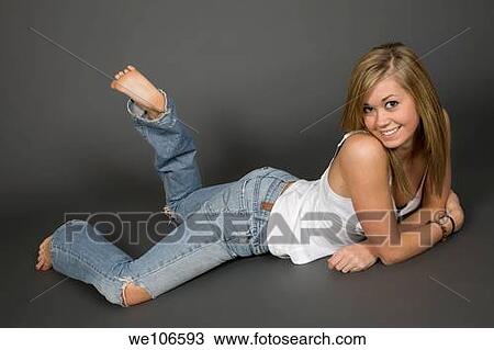 Teenage girl posing on gray background with some attitude View Large Photo Image Stock Image - Teenage girl posing on gray background with some attitude. Fotosearch