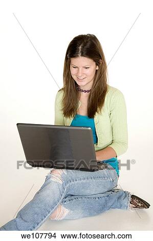 Teenage girl working on laptop computer View Large Photo Image Picture - Teenage girl working on laptop computer. Fotosearch