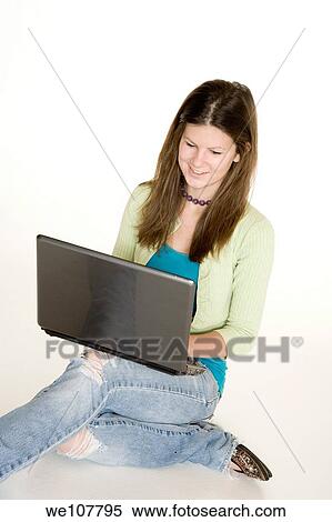 Teenage girl working on laptop computer View Large Photo Image Stock Photography - Teenage girl working on laptop computer. Fotosearch