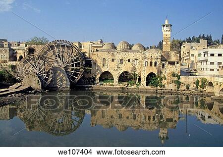 Picture - The Great Mosque of al-Nuri and a waterwheel on the Orontes River, Hama, Syria. Fotosearch