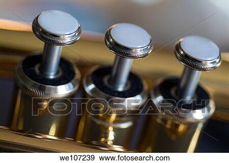 Three musical keys on a shiny trumpet View Large Photo Image Stock Photo - Three musical keys on a shiny trumpet. Fotosearch