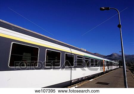 Stock Photography - Train stopped at a railway station, Provence, France. Fotosearch