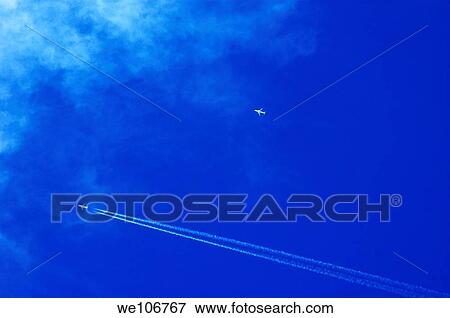 Stock Photo - Two aeroplanes flying over Brittany, France. Fotosearch