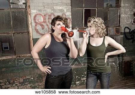Two female friends partying in an old factory View Large Photo Image Stock Photo - Two female friends partying in an old factory. Fotosearch