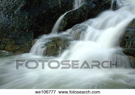Waterfall cascading into Li Jiang River, Yangshuo, Guangxi, China View Large Photo Image Stock Photo - Waterfall cascading into Li Jiang River, Yangshuo, Guangxi, China. Fotosearch