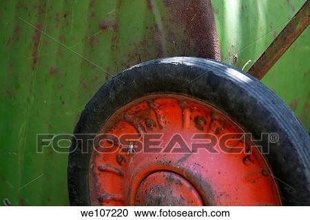 Wheel of a rusting old wheelbarrow View Large Photo Image Stock Image - Wheel of a rusting old wheelbarrow. Fotosearch