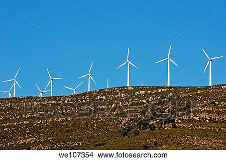 Picture - Wind turbines on ridge above the Playa De Los Lances, Tarifa, Andalusia, Spain. Fotosearch