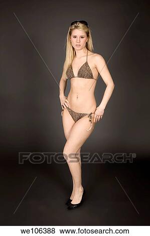 Woman posing in a swimsuit with some attitude View Large Photo Image Stock Photo - Woman posing in a swimsuit with some attitude. Fotosearch