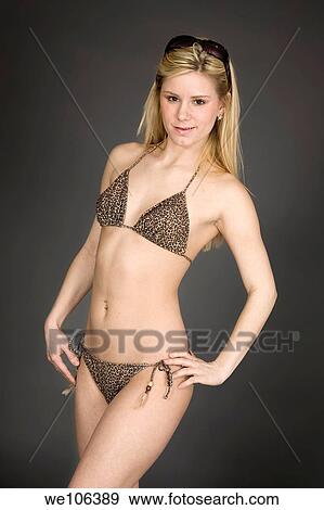 Stock Photo - Woman posing in a swimsuit with some attitude. Fotosearch