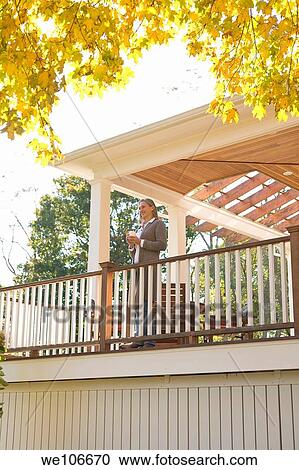 Woman with Coffee On Porch View Large Photo Image Stock Image - Woman with Coffee On Porch. Fotosearch