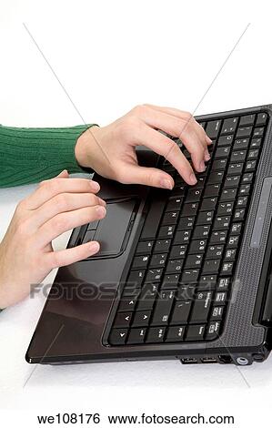 Stock Photograph - Young woman working on laptop computer on white background. Fotosearch