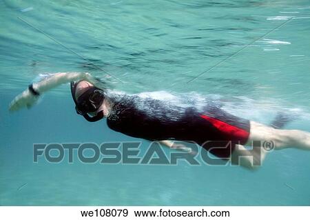 A snorkeler swimming in the Mediterranean Sea View Large Photo Image Stock Photo - A snorkeler swimming in the Mediterranean Sea. Fotosearch