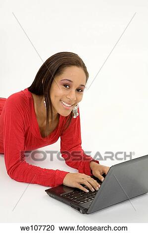 African American teen working on laptop computer View Large Photo Image Stock Image - African American teen working on laptop computer. Fotosearch