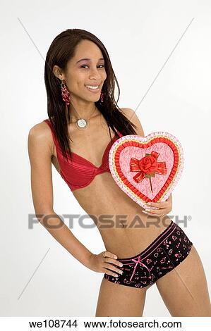 African American woman in early 20's doing glamour modeling for Valentines Day View Large Photo Image Picture - African American woman in early 20's doing glamour modeling for Valentines Day. Fotosearch