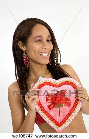 African American woman in early 20's doing glamour modeling for Valentines Day View Large Photo Image Stock Photo - African American woman in early 20's doing glamour modeling for Valentines Day. Fotosearch