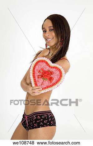African American woman in early 20's doing glamour modeling for Valentines Day View Large Photo Image Stock Photo - African American woman in early 20's doing glamour modeling for Valentines Day. Fotosearch