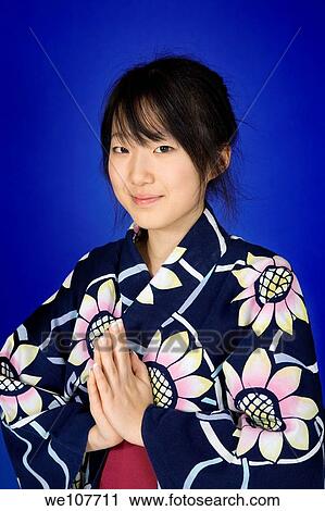 Asian teen dressed in a Kimono or Yukata View Large Photo Image Stock Image - Asian teen dressed in a Kimono or Yukata. Fotosearch