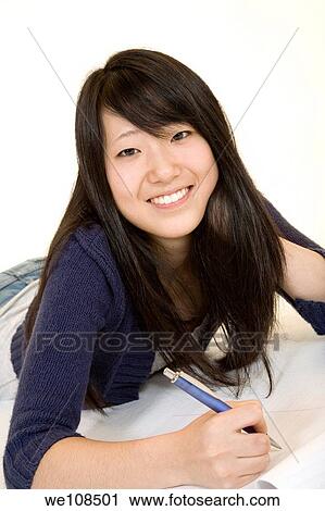 Asian teenage working on homework View Large Photo Image Stock Image - Asian teenage working on homework. Fotosearch