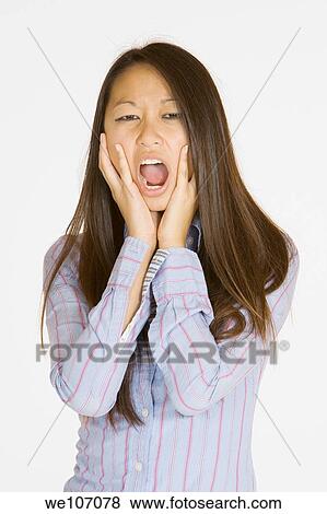Asian woman showing signs of anger View Large Photo Image Stock Photo - Asian woman showing signs of anger. Fotosearch