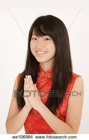 Beautiful Asian teenager in traditional dress on white background View Large Photo Image Picture - Beautiful Asian teenager in traditional dress on white background. Fotosearch