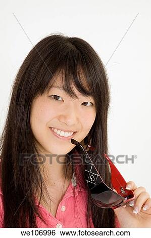 Beautiful Asian teenager on white background View Large Photo Image Stock Photograph - Beautiful Asian teenager on white background. Fotosearch