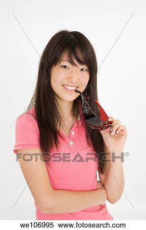 Beautiful Asian teenager on white background View Large Photo Image Stock Photography - Beautiful Asian teenager on white background. Fotosearch