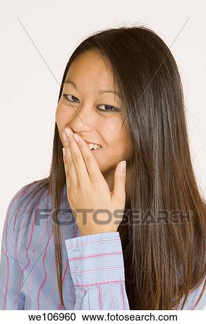 Beautiful Asian woman posing with some attitude on a white background View Large Photo Image Stock Image - Beautiful Asian woman posing with some attitude on a white background. Fotosearch