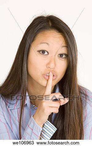 Beautiful Asian woman posing with some attitude on a white background View Large Photo Image Stock Image - Beautiful Asian woman posing with some attitude on a white background. Fotosearch