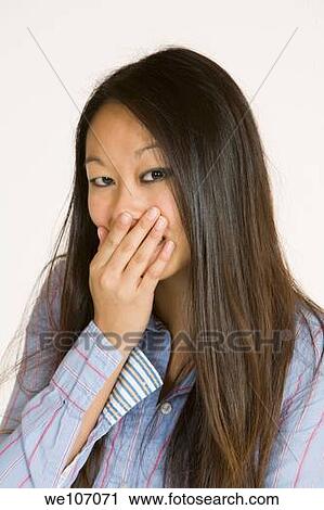 Beautiful Asian woman posing with some attitude on a white background View Large Photo Image Stock Image - Beautiful Asian woman posing with some attitude on a white background. Fotosearch
