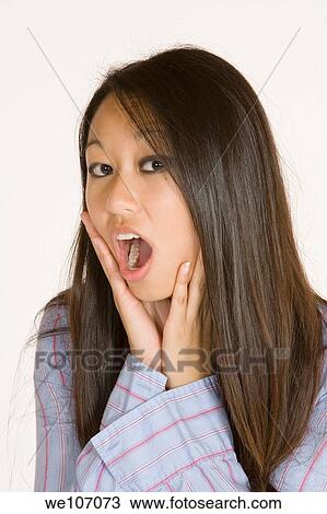 Beautiful Asian woman posing with some attitude on a white background View Large Photo Image Stock Image - Beautiful Asian woman posing with some attitude on a white background. Fotosearch