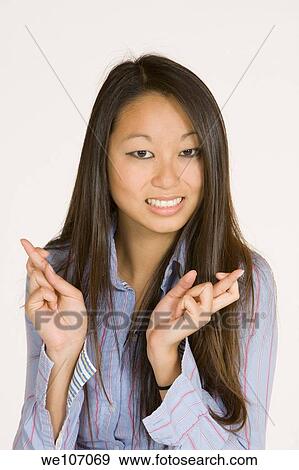 Beautiful Asian woman posing with some attitude on a white background View Large Photo Image Stock Photo - Beautiful Asian woman posing with some attitude on a white background. Fotosearch