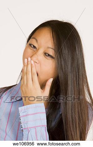 Beautiful Asian woman posing with some attitude on a white background View Large Photo Image Stock Photograph - Beautiful Asian woman posing with some attitude on a white background. Fotosearch