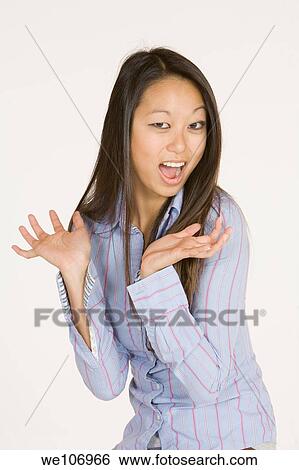 Beautiful Asian woman posing with some attitude on a white background View Large Photo Image Stock Photograph - Beautiful Asian woman posing with some attitude on a white background. Fotosearch