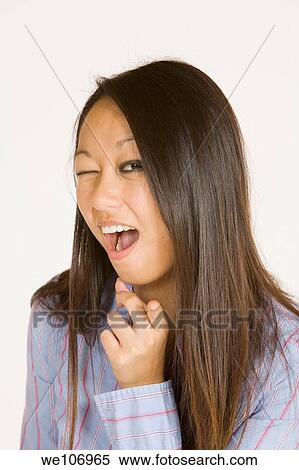 Beautiful Asian woman posing with some attitude on a white background View Large Photo Image Stock Photography - Beautiful Asian woman posing with some attitude on a white background. Fotosearch