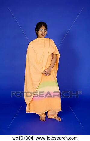 Beautiful Hindu teenager dressed in a traditional Indian dress View Large Photo Image Picture - Beautiful Hindu teenager dressed in a traditional Indian dress. Fotosearch